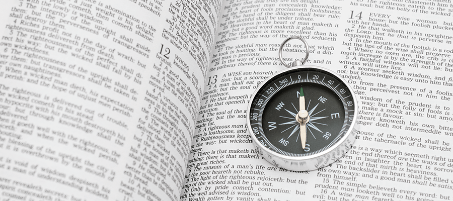 Compass over bible